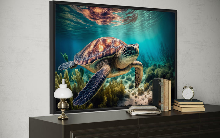 Framed canvas wall art of a sea turtle swimming over a vibrant coral reef in clear blue water.