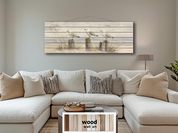 Large horizontal wood wall art featuring three seagulls on beach posts for coastal home decor.