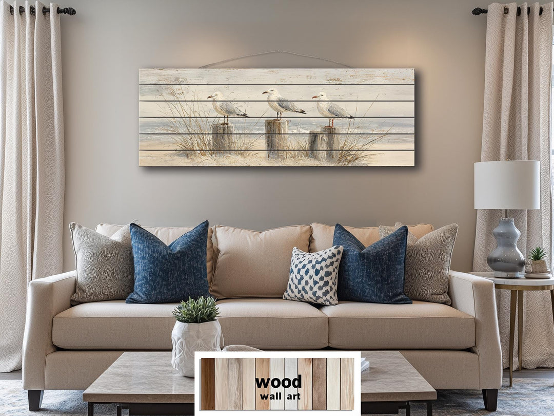 Large horizontal wood wall art featuring three seagulls on beach posts for coastal home decor.