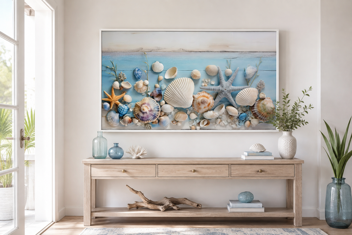 Seashells painting on blue wood coastal wall art displayed above a wooden console table.