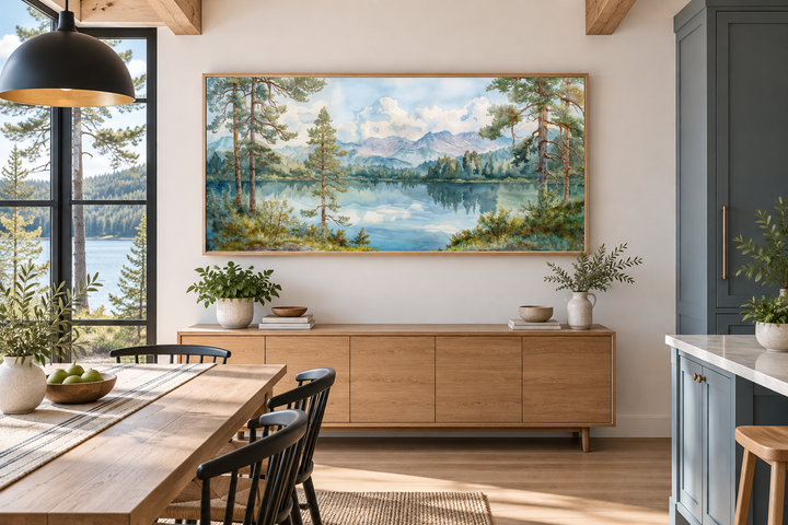 Serene mountain lake landscape framed canvas wall art above a wooden sideboard in a dining room.