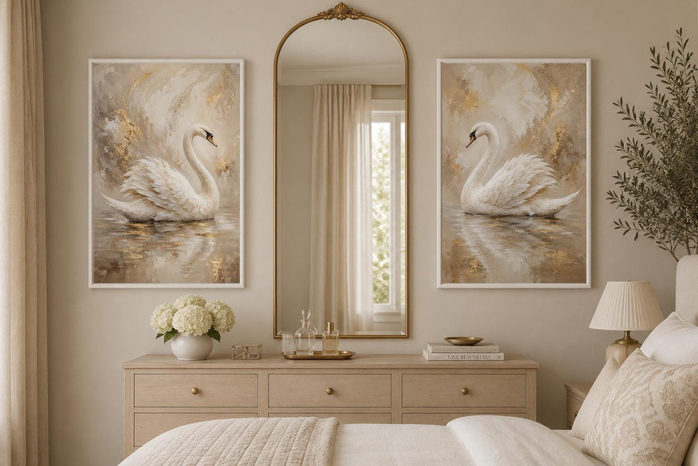 Set of 2 white swan canvas art prints with gold accents in a glam bedroom above a dresser.