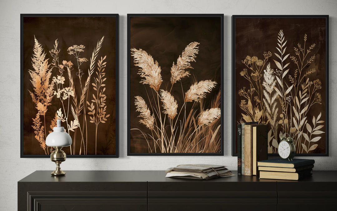Set of 3 framed canvas prints featuring botanical grass in brown and beige earth tones.