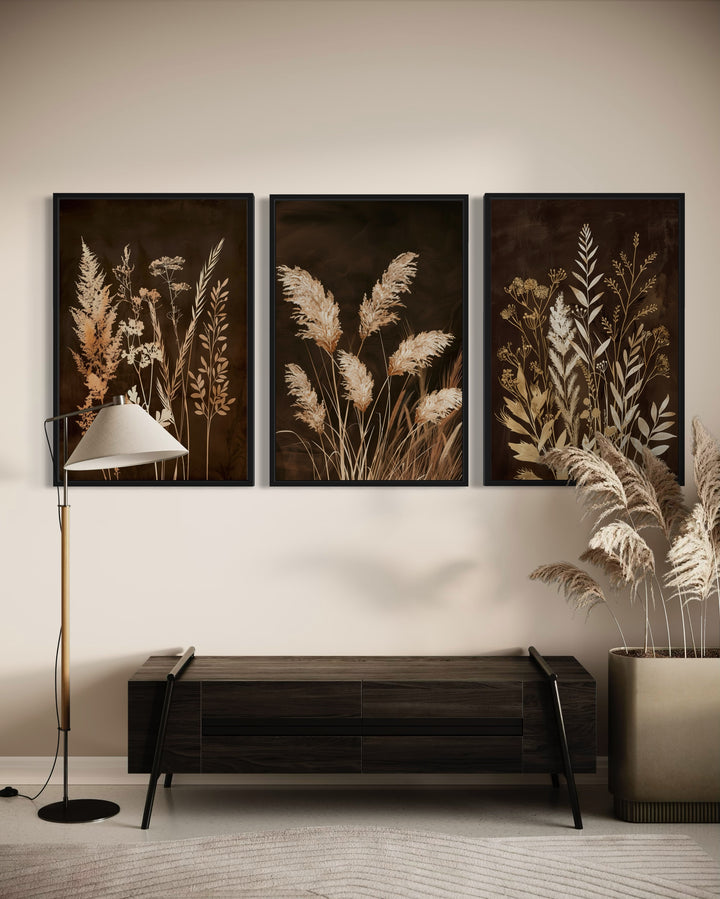 Set of 3 vertical canvases featuring botanical grass illustrations in brown and beige earth tones.