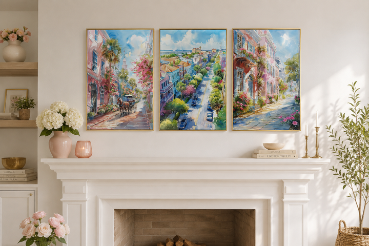 Set of three framed watercolor canvas paintings of Charleston city streets above a white fireplace.