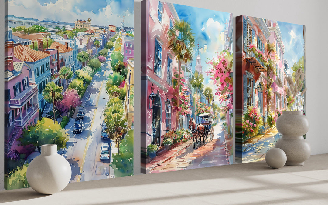 Set of three framed canvas wall art pieces featuring watercolor paintings of Charleston city scenes.