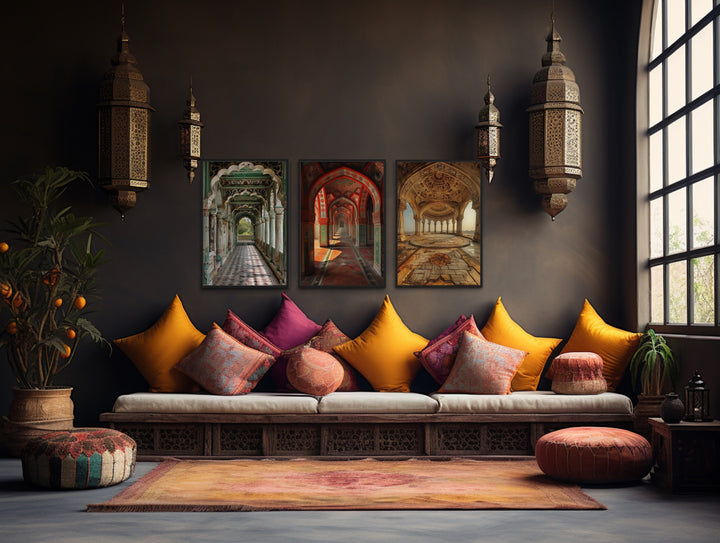 Set of three framed canvas prints featuring colorful Indian Mughal architecture on a dark wall.