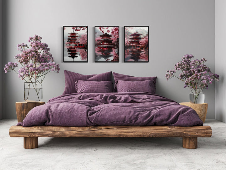Set of three framed wall art pieces featuring Japanese pagodas and pink cherry blossoms.