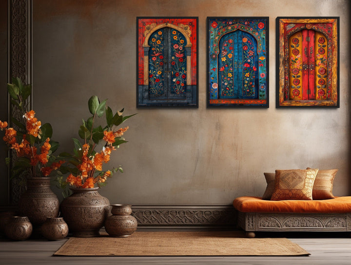 Set of three Madhubani door paintings on canvas in a bohemian living room with traditional decor.