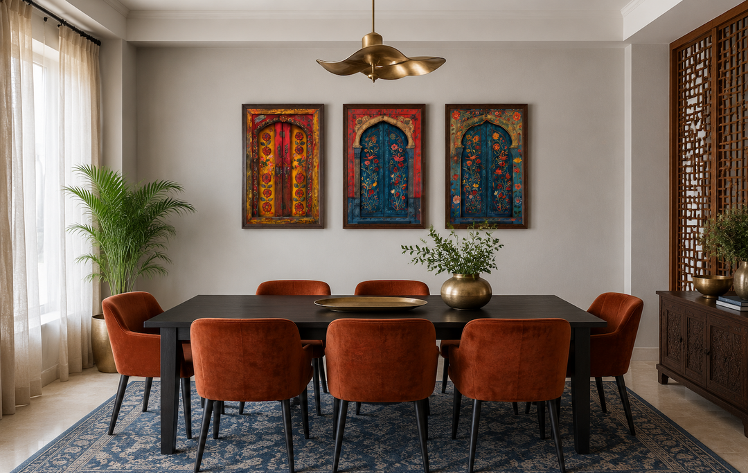 Set of three Madhubani door paintings on canvas, framed and hung above a dining table.