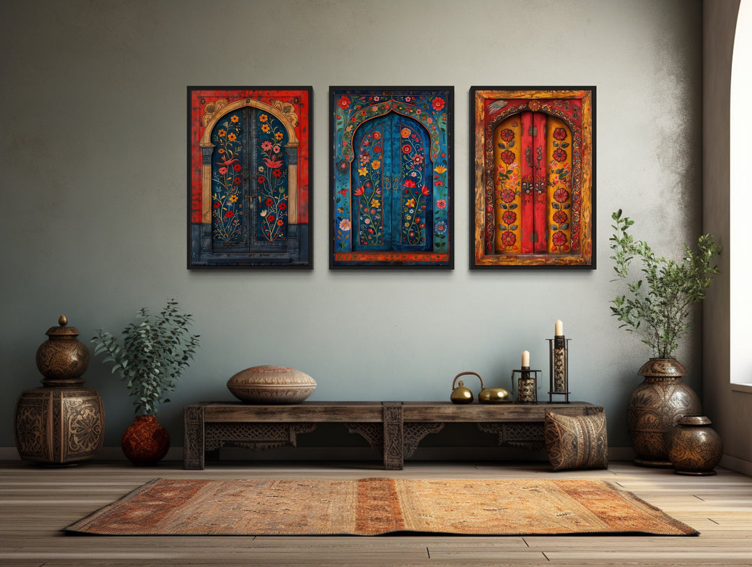 Set of three Madhubani door paintings on canvas displayed above a wooden bench in a living room.