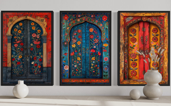 Set of three Madhubani door paintings on canvas with vibrant floral patterns and arched frames.