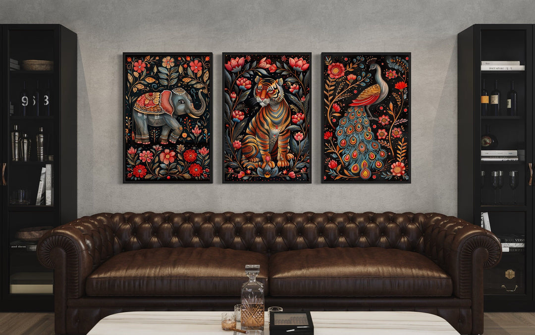 Set of three Madhubani style framed canvas prints featuring an elephant, tiger, and peacock.