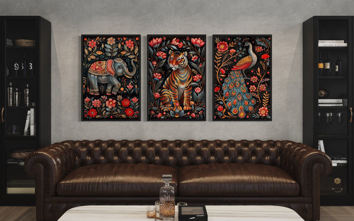 Set of three Madhubani style framed canvas prints featuring an elephant, tiger, and peacock.
