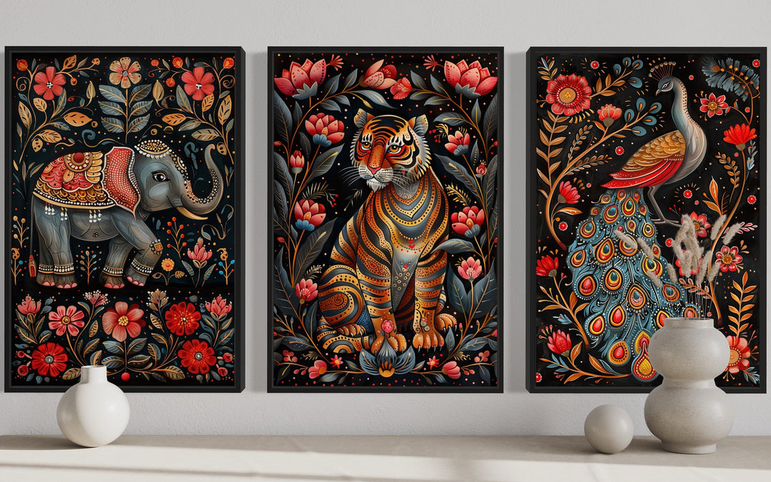 Set of three Madhubani style framed canvas wall art featuring a tiger, elephant, and peacock.