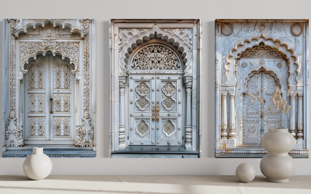 Set of three framed canvas prints featuring intricately carved neutral grey Indian doors.