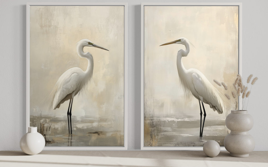 Set of 2 framed canvas wall art pieces featuring great egrets in neutral beige and white tones.