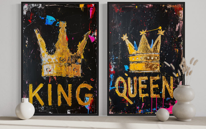 Set of 2 framed pop art canvas prints featuring gold King and Queen crowns on black backgrounds.