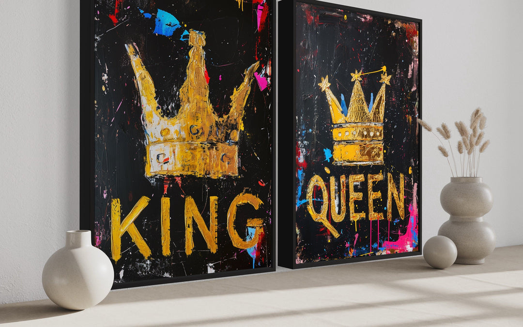 Set of 2 framed pop art canvas prints featuring gold King and Queen crowns on a black background.