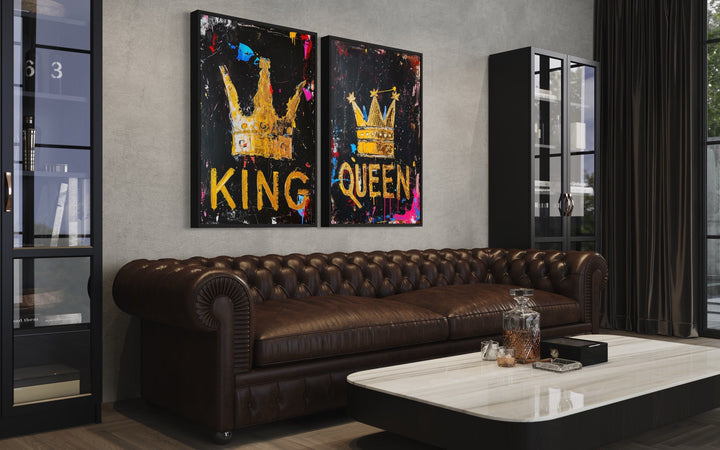 Set of 2 King and Queen crowns pop art framed canvas wall art above a brown leather sofa.