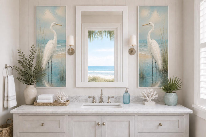 Set of two tall narrow canvas prints featuring white egrets in a coastal setting flanking a mirror.