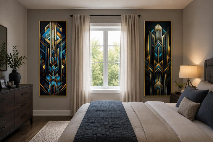 Set of 2 tall vertical Art Deco geometric canvas panels in navy blue and gold in a bedroom.