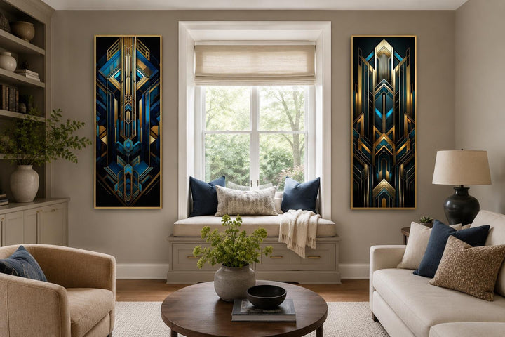 Set of 2 tall vertical Art Deco geometric canvas panels in navy blue and gold on a living room wall.