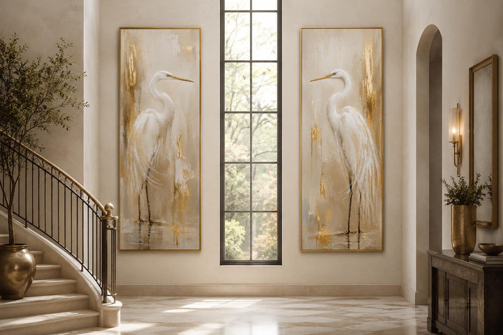 Set of 2 tall narrow canvas prints featuring white egrets with gold accents in a modern entryway.