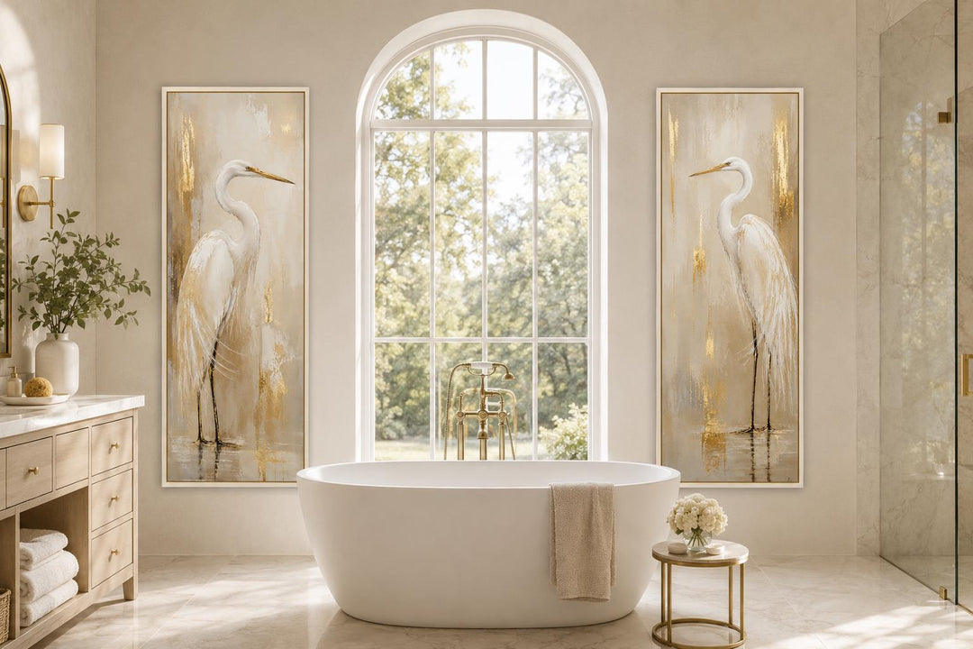 Set of 2 tall narrow canvas prints featuring white egrets with gold accents in a bathroom setting.