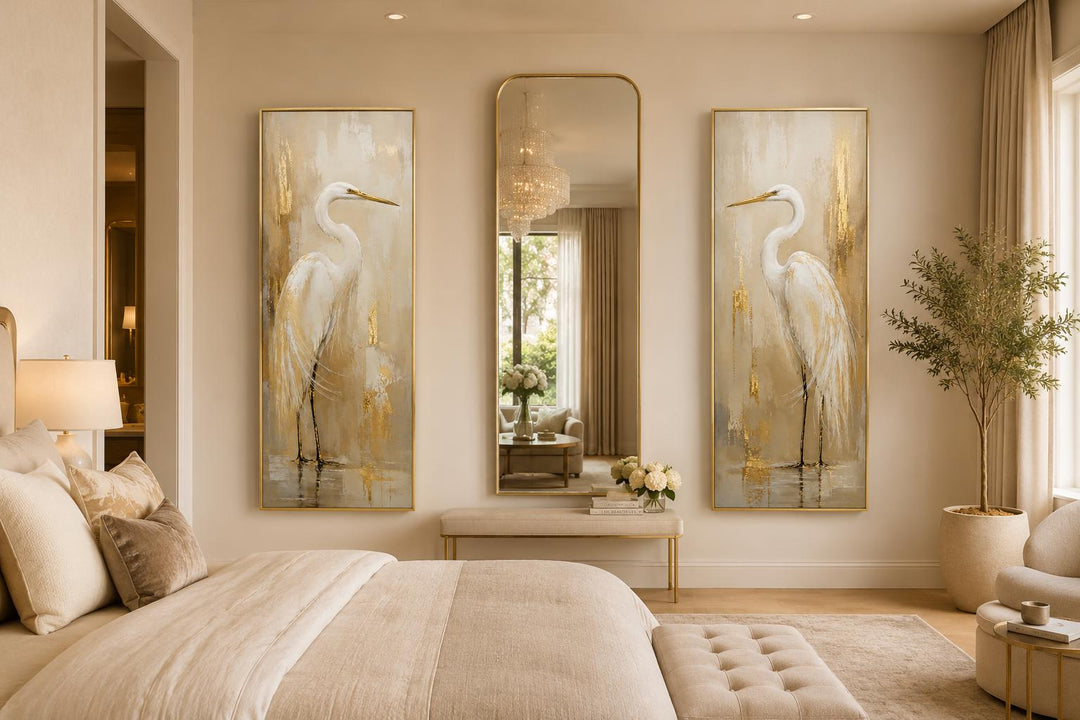 Set of 2 tall narrow canvas prints featuring white egrets with gold accents flanking a wall mirror.