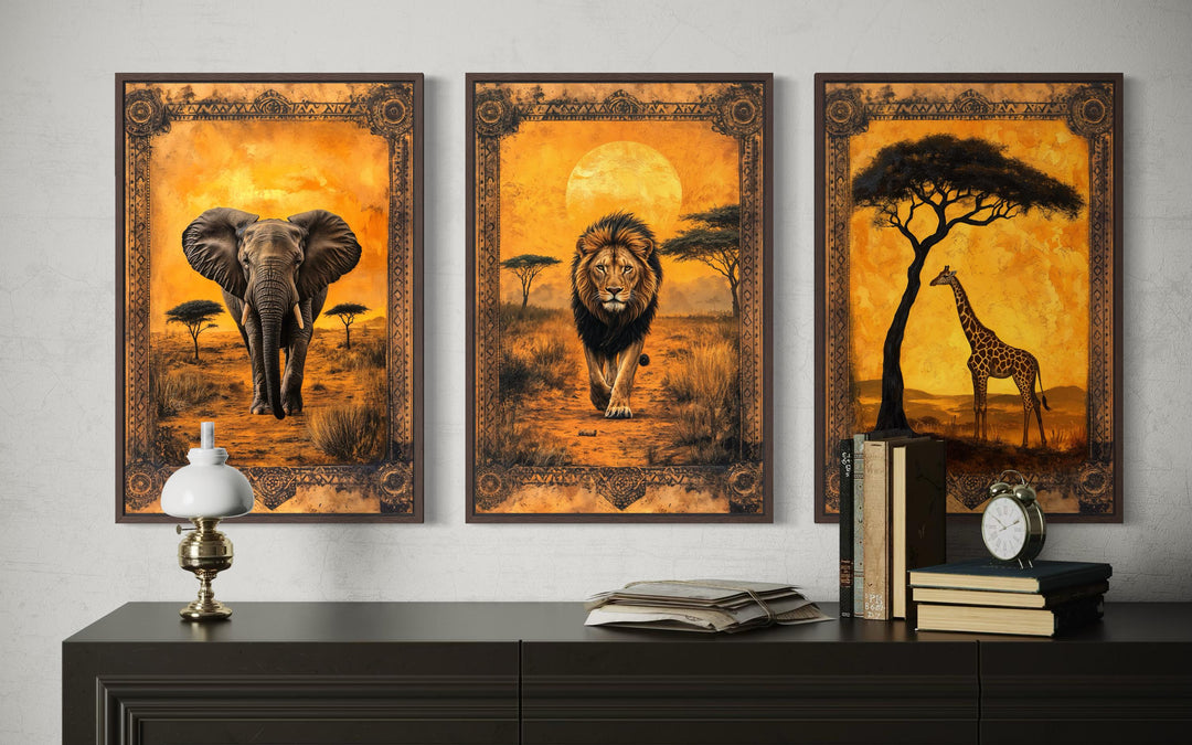 Set of 3 African animals in savanna wall art featuring an elephant, lion, and giraffe.