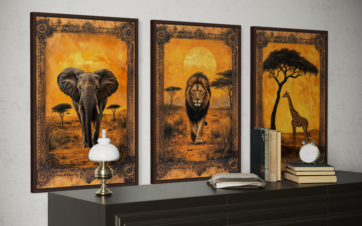 Set of 3 African animals in savanna wall art featuring an elephant, lion, and giraffe.