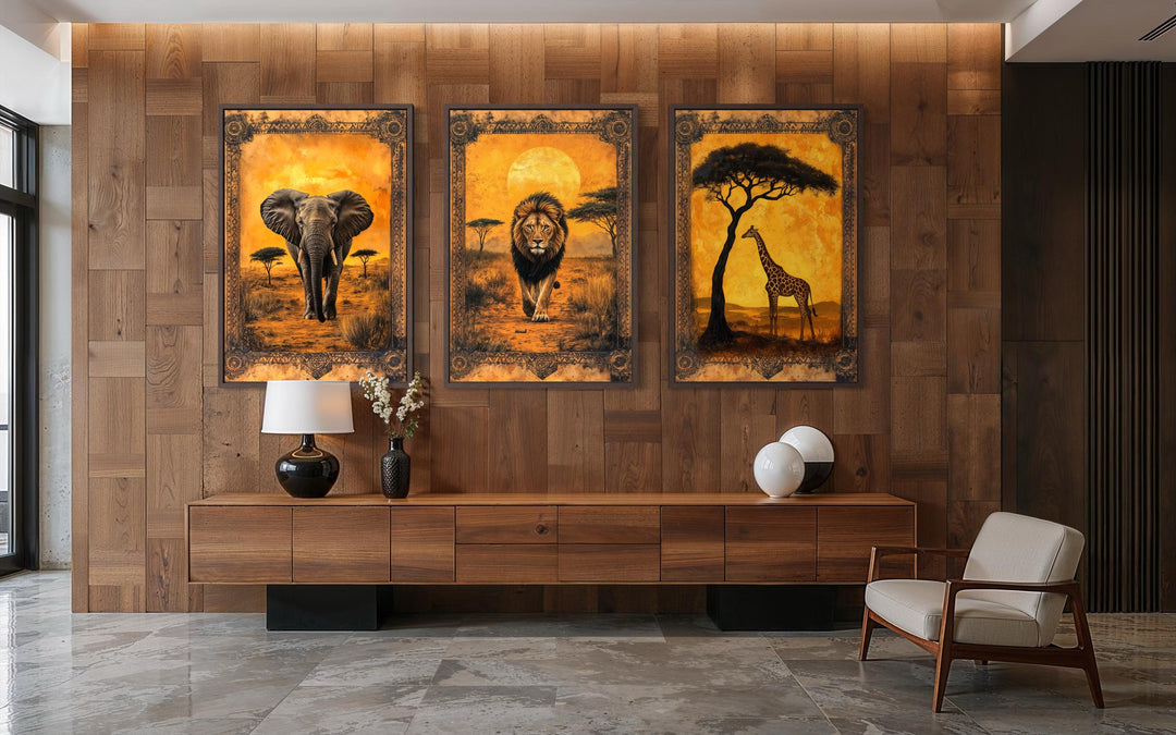 Set of three vertical African savanna wall art panels featuring an elephant, lion, and giraffe.