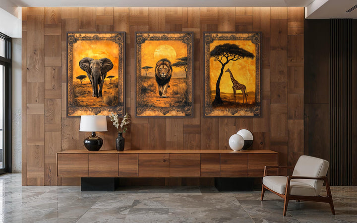 Set of three vertical African savanna wall art panels featuring an elephant, lion, and giraffe.