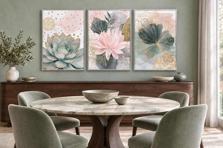 Set of 3 blush pink and teal succulent floral framed canvas wall art hung above a wooden sideboard.