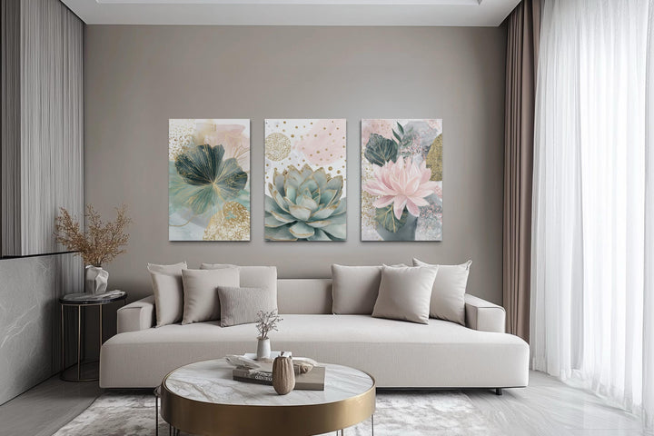 Set of 3 blush pink and teal succulent floral framed canvas wall art hung above a beige sofa.