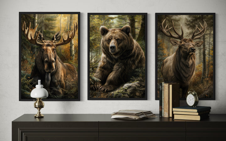 Set of 3 framed canvas prints featuring a moose, a bear, and an elk in a forest setting.