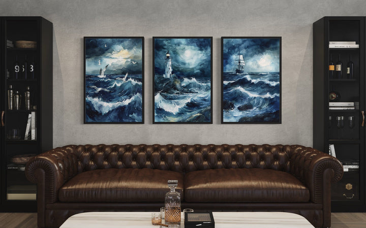 Set of 3 framed canvas prints featuring a lighthouse, sail ship, and seagulls in a stormy ocean.