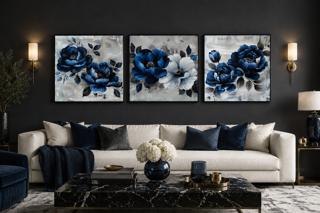 Set of 3 navy blue and gray floral square canvas prints displayed above a white sofa.