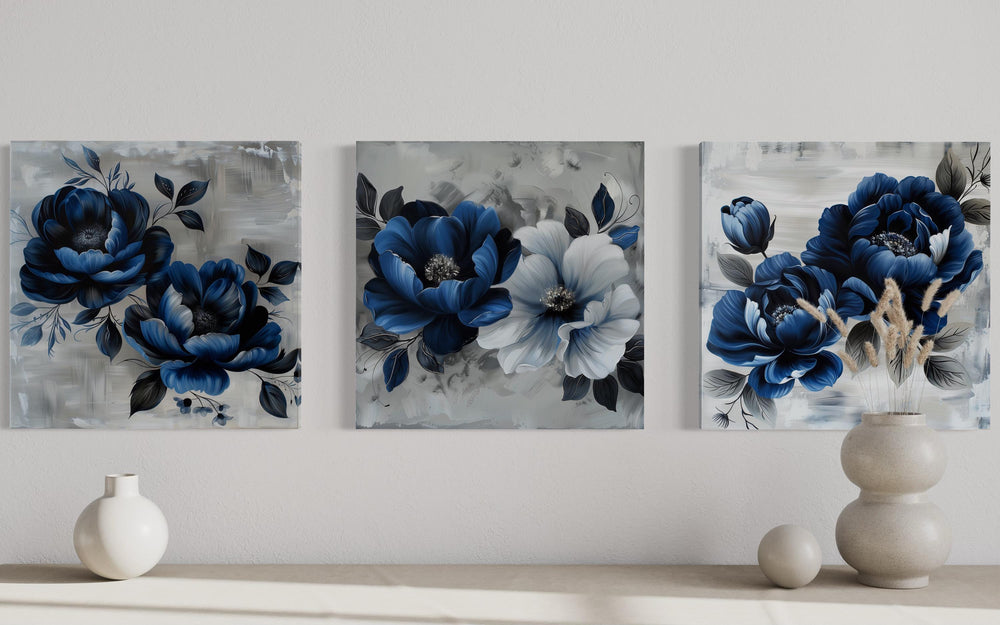 Set of 3 navy blue and gray floral square canvas prints displayed on a neutral wall.