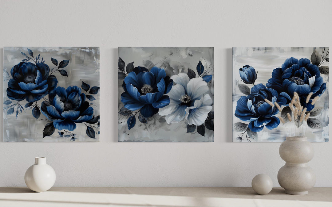 Set of 3 navy blue and gray floral square canvas prints displayed on a neutral wall.