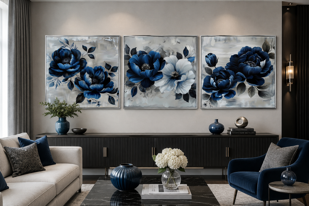 Set of 3 square canvas prints featuring navy blue and gray floral blooms in a modern living room.