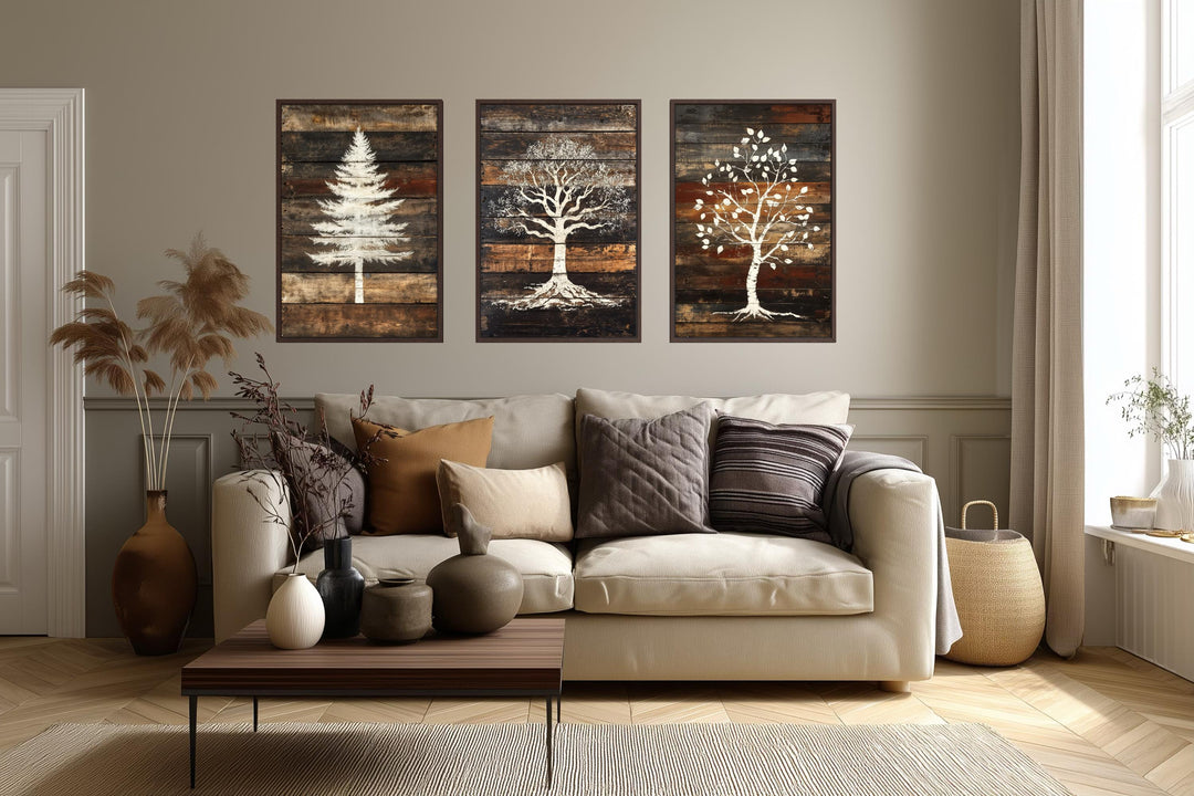 Set of 3 rustic pine, oak, and birch tree silhouettes on wood plank canvas wall art.