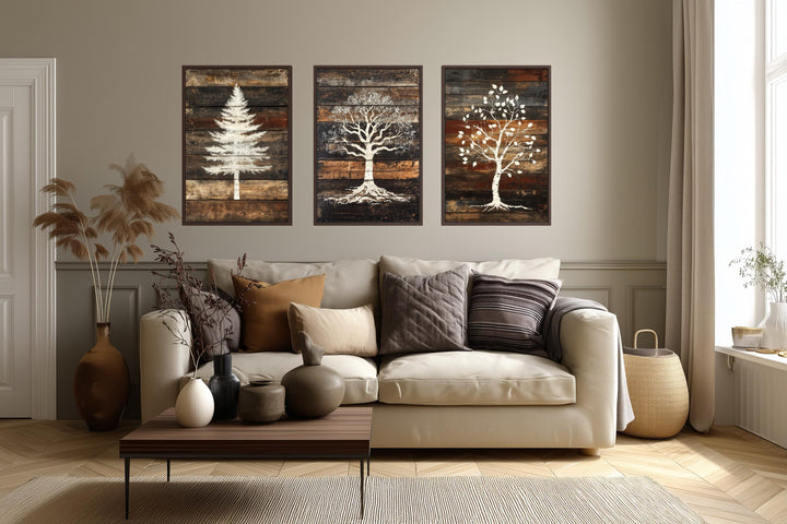Set of 3 rustic pine, oak, and birch tree silhouettes on wood plank canvas wall art.