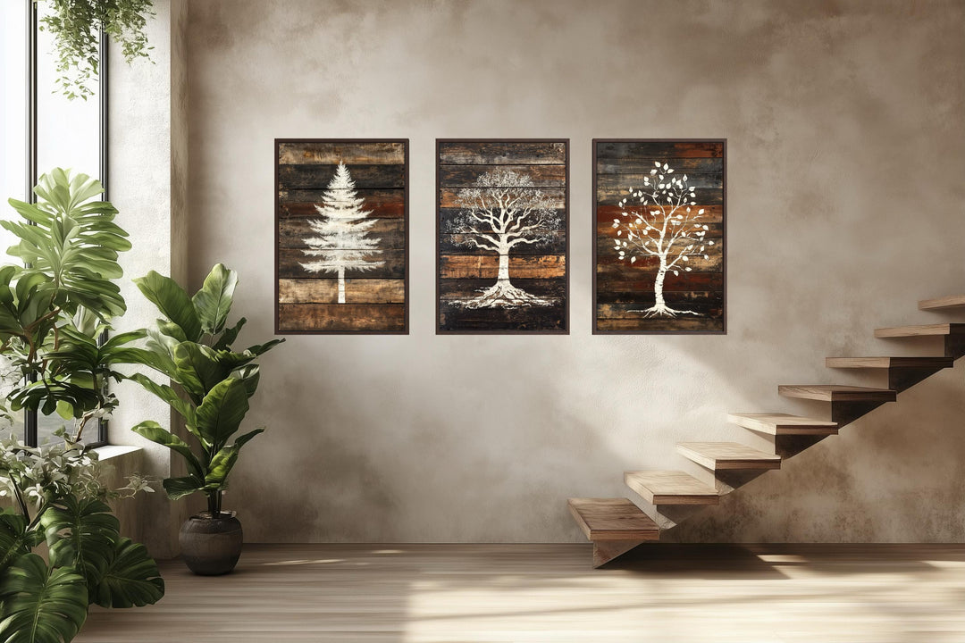 Set of 3 rustic pine, oak, and birch tree silhouettes on dark wood plank canvas wall art.