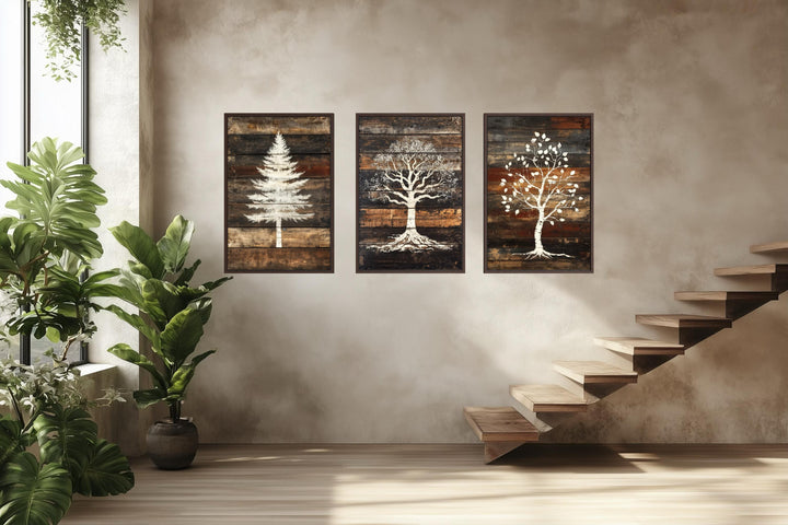 Set of 3 rustic pine, oak, and birch tree silhouettes on dark wood plank canvas wall art.