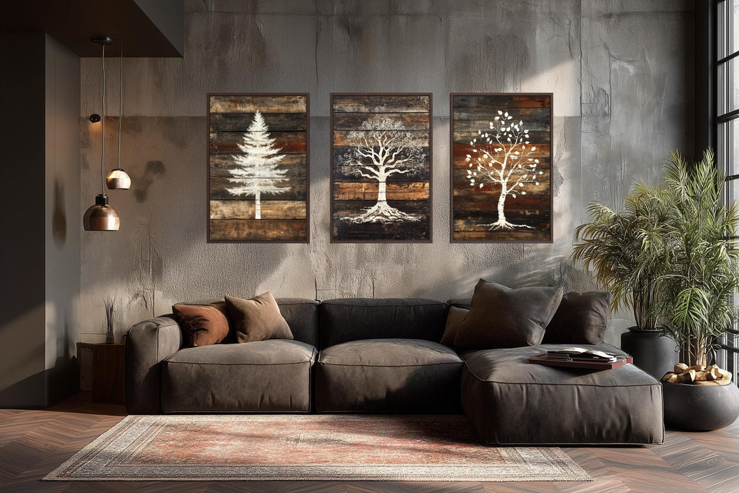 Set of 3 rustic pine, oak, and birch tree silhouettes on wood plank canvas wall art.