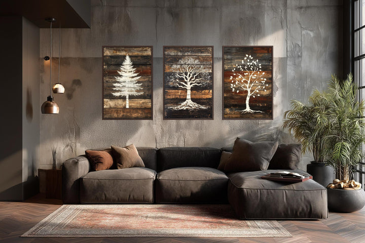 Set of 3 rustic pine, oak, and birch tree silhouettes on wood plank canvas wall art.