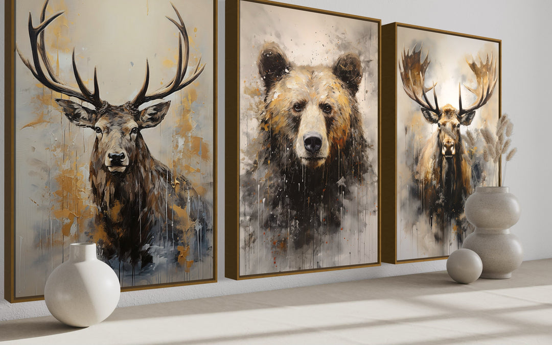 Set of 3 framed wildlife canvas prints featuring an elk, a bear, and a moose in a rustic art style.