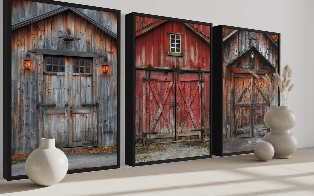 Set of three framed canvas wall art pieces featuring rustic red and weathered wood barn doors.